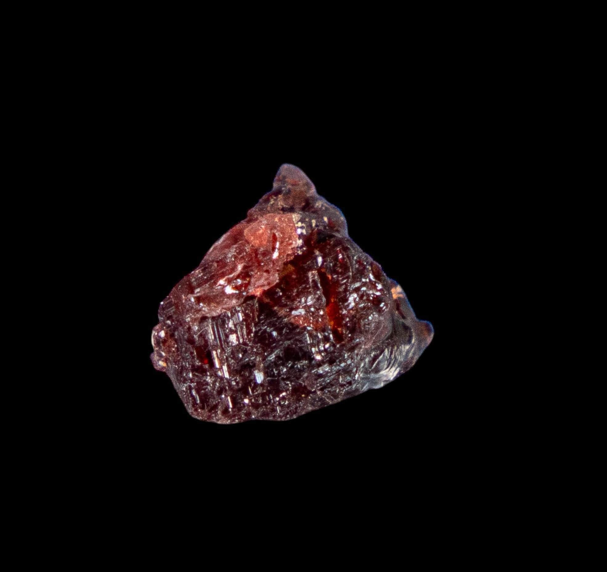 Etched spessartine garnet color change stone ideal for collectors of fine minerals or thumbnail displays from brazil